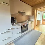 Çiftlik konaklama Woerglerhof's Huettenapartments Mit Kachelofen